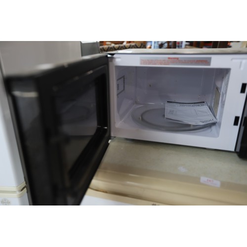 166 - Microwave - warranted until 12 noon Tuesday following the above sale