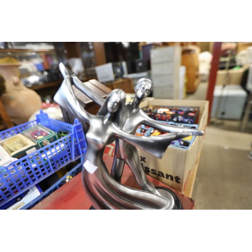 374 - Pair of silver coloured statues