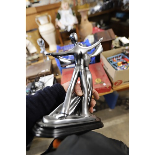 374 - Pair of silver coloured statues