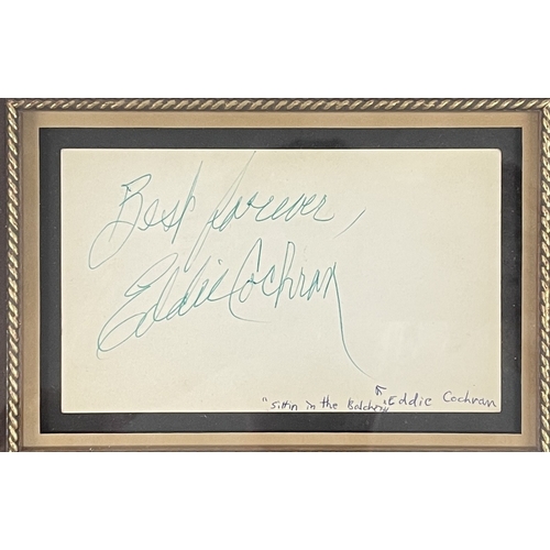 20 - EDDIE COCHRAN - SIGNED DISPLAY. A framed and glazed display to include a page from an autograph book... 