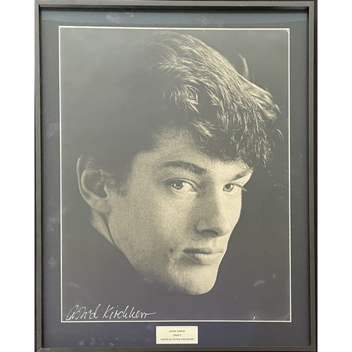 29 - ASTRID KIRCHHERR - A SIGNED ORIGINAL PHOTOGRAPH DEPICTING JACKIE LOMAX. A mounted, framed and glazed... 