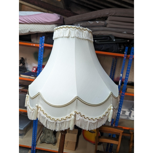 28 - Turned Wooden Standard Lamp With Large Cream Shade
Needs Re- Wiring
Height to shade 150cm
Shade diam... 