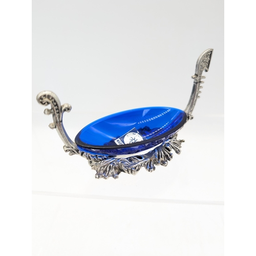 297 - White Metal and Blue Glass Salt Cellars With Spoons, Along With A Murano Gondola And White Metal Sal... 