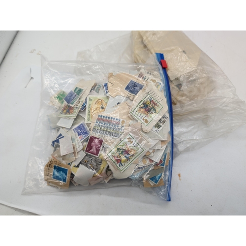 446 - 2 Bags of Loose Stamps