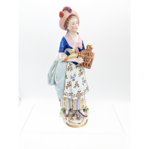 177 - Sitzendorf Porcelain Figure With Bird and Cage, Has a Loss to Wing.
25cm