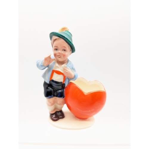 310 - Small German Ceramic Figure of Boy and Heart Lederhosen 
8x8cm