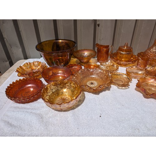 58 - Huge Collection of Amber Carnival Glass To Include 40cm Punch Bowl, Plates, Decanters, Shells Jugs E... 