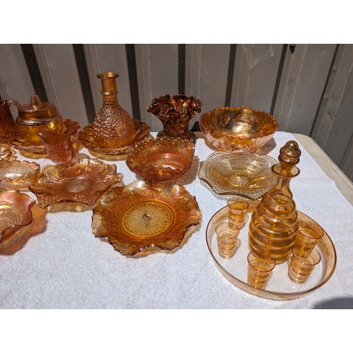 58 - Huge Collection of Amber Carnival Glass To Include 40cm Punch Bowl, Plates, Decanters, Shells Jugs E... 