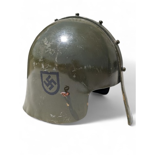 113 - Military Style Helmet With Nose Guard and German Insignia.