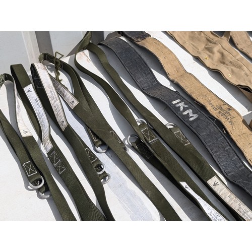 124 - Quantity Military Issue Belts, Leg Braces Etc