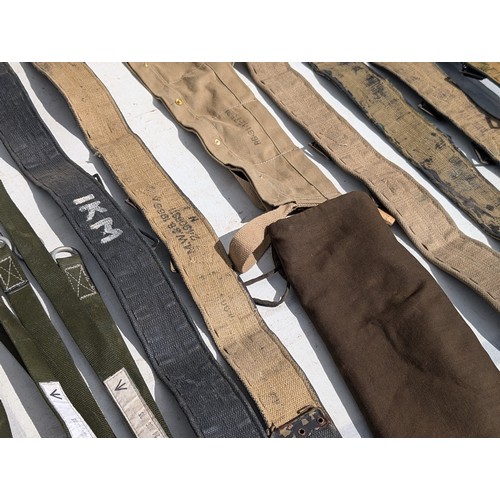 124 - Quantity Military Issue Belts, Leg Braces Etc