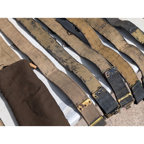 124 - Quantity Military Issue Belts, Leg Braces Etc