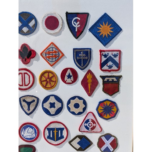 93 - Extensive and Well Framed Display of United States Military Shoulder Patches 78x70cm