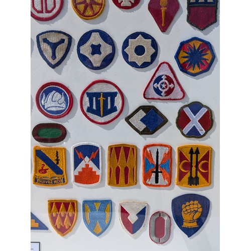 93 - Extensive and Well Framed Display of United States Military Shoulder Patches 78x70cm