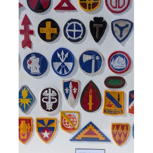 93 - Extensive and Well Framed Display of United States Military Shoulder Patches 78x70cm