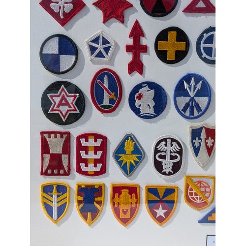 93 - Extensive and Well Framed Display of United States Military Shoulder Patches 78x70cm