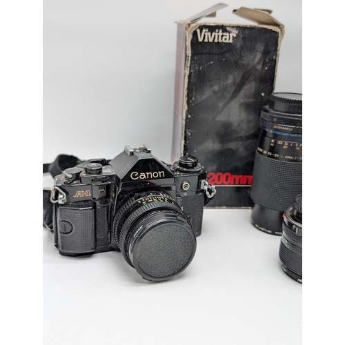 332 - A Canon A1 35mm film SLR & Minolta X700 with Canon Lens FD 50mm 1:1.8 Lens Plus FD 24mm 1:2.8 & carl... 