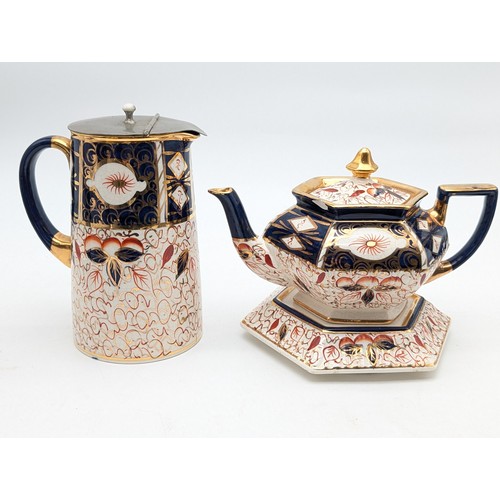 194 - Pair Antique Arthur Wood Imari Pattern teapot With Stand & Coffee Pot. Teapot has Chip as Seen