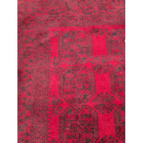 12 - Excellent Hand Knotted Afghan Carpet/ Rug with A few Ware Patches on Red Ground 120x78 inches