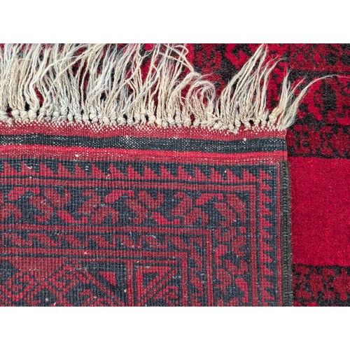 12 - Excellent Hand Knotted Afghan Carpet/ Rug with A few Ware Patches on Red Ground 120x78 inches