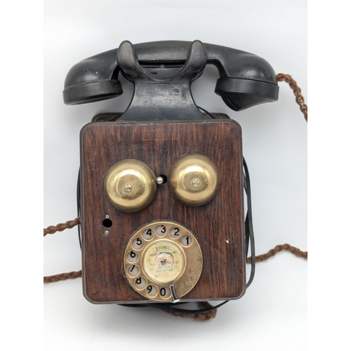 221 - WW2 Era 1945. Brass and Bakelite Wall Mounted Telephone. Marked V2748A with Internal Untested.