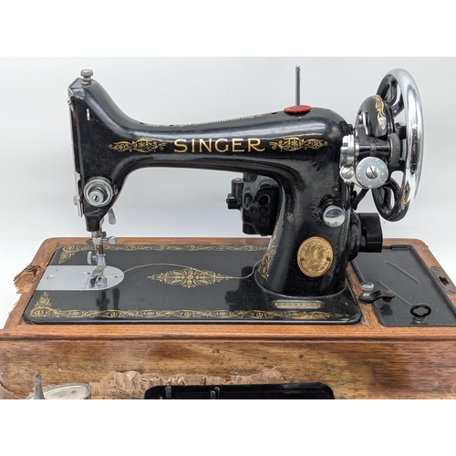 242 - Singer 99K Sewing Machine, Damaged Case, Machine Appears in Good Order, Accessory Pack and Oiler in ... 