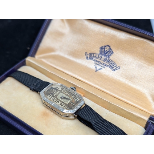 560 - Unusual Art Deco White Metal Cased Tank Watch in an Ellis Bro's Box. In need of Repair.