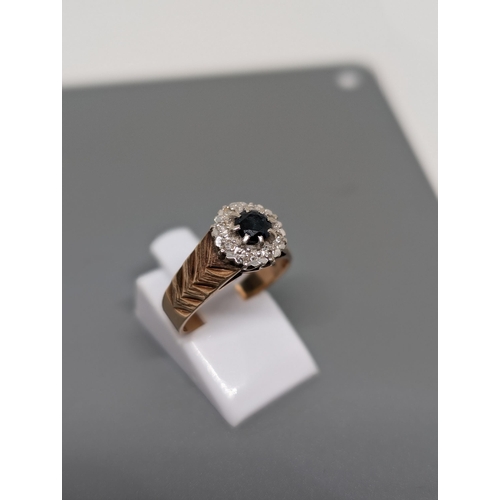 572 - 9Ct Gold Diamond and Deep Blue Sapphire Ring. Approximately Size and Weighs 3.6g.