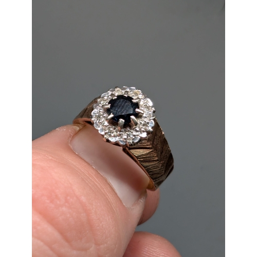 572 - 9Ct Gold Diamond and Deep Blue Sapphire Ring. Approximately Size and Weighs 3.6g.