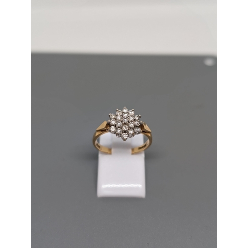 575 - 9CT Gold and Diamond Cluster Ring  Weighs 3.35g and approximate Size  N. Hallmarked.