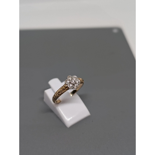 578 - 9Ct Gold and Diamond Cluster Ring. Hallmarked. Approximate Size N and Weighs 2.23g.