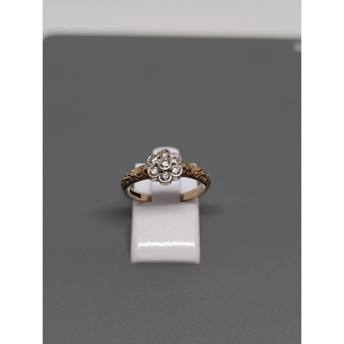 578 - 9Ct Gold and Diamond Cluster Ring. Hallmarked. Approximate Size N and Weighs 2.23g.