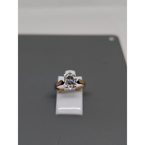 579 - 9Ct Gold and Diamond Cluster Ring. Weighing 1.5g and Approximate Size L. Hallmarked