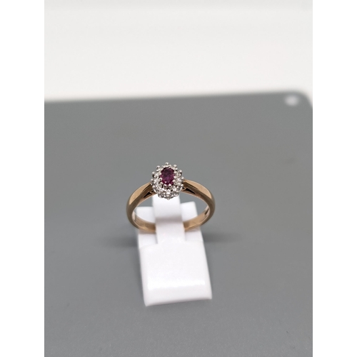 582 - Delightful 9Ct Gold, Diamond and Ruby Ring Marked LC95. Weighs 3.31g and is Approximately Size N