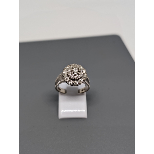 589 - 18Ct White Gold and Diamond Ring Marked AD LTD. Approximate Size  M/N and Weighs 4.94g.