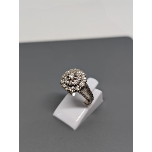 589 - 18Ct White Gold and Diamond Ring Marked AD LTD. Approximate Size  M/N and Weighs 4.94g.