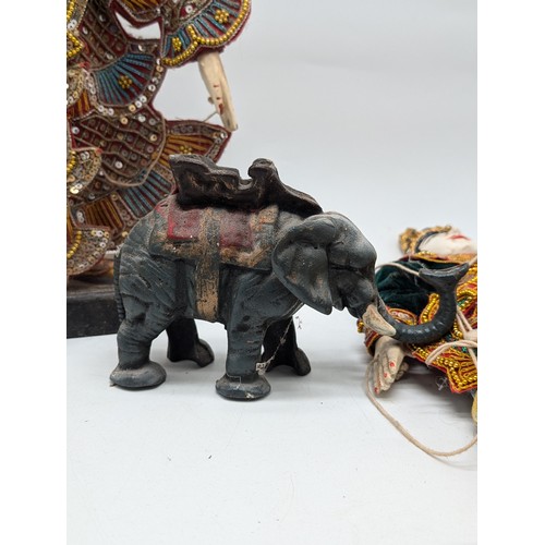 231 - Small Collectable Group Indonesian Thai Burmese Marionette Dolls Plus Cast Iron Elephant Money Bank