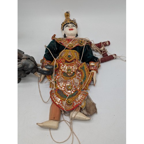 231 - Small Collectable Group Indonesian Thai Burmese Marionette Dolls Plus Cast Iron Elephant Money Bank