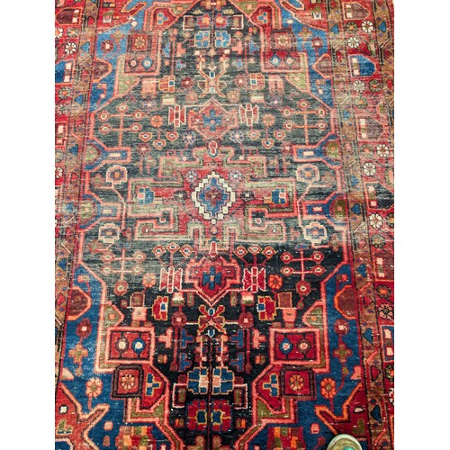 137 - A Persian Nahavand Rug 210x136 Red Ground Rug, With Wear Patches as Seen