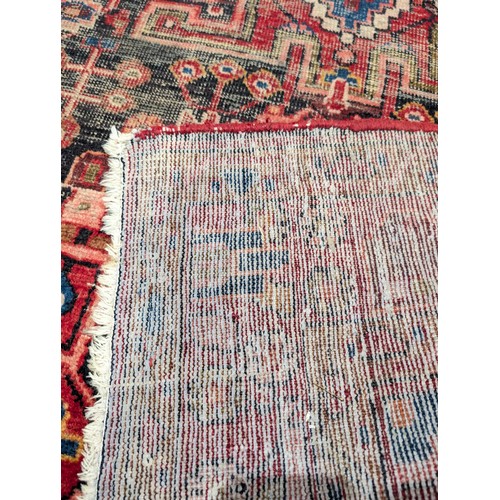 137 - A Persian Nahavand Rug 210x136 Red Ground Rug, With Wear Patches as Seen