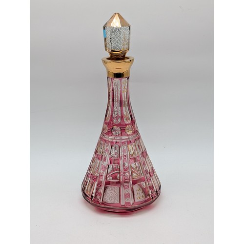 131 - Bohemian Pink Flashed And Cut Glass Decanter With Stopper, Conical Shape. Heightened With Gilded Ver... 