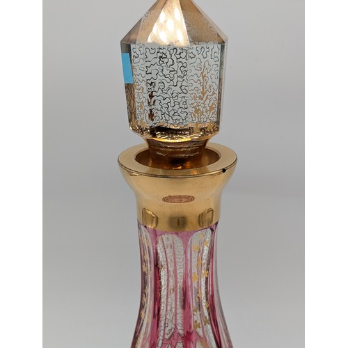 131 - Bohemian Pink Flashed And Cut Glass Decanter With Stopper, Conical Shape. Heightened With Gilded Ver... 