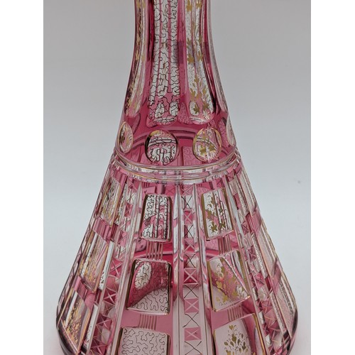 131 - Bohemian Pink Flashed And Cut Glass Decanter With Stopper, Conical Shape. Heightened With Gilded Ver... 