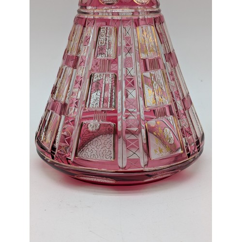 131 - Bohemian Pink Flashed And Cut Glass Decanter With Stopper, Conical Shape. Heightened With Gilded Ver... 