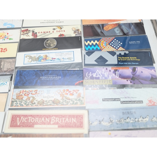 A large collection of Royal Mail presentation packs, comprising a wide ...