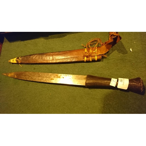 353 - African dagger in leather scabbard