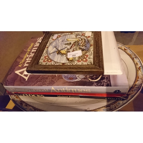 354 - Oval platter with clocks and antique books