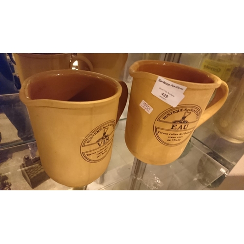 429 - Terracotta French wine and water jugs