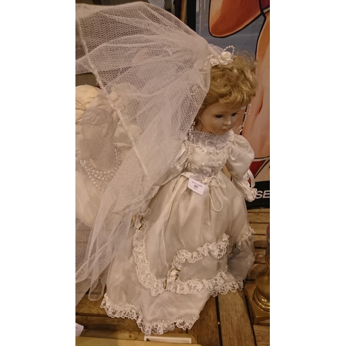 687 - Porcelin doll in a wedding dress