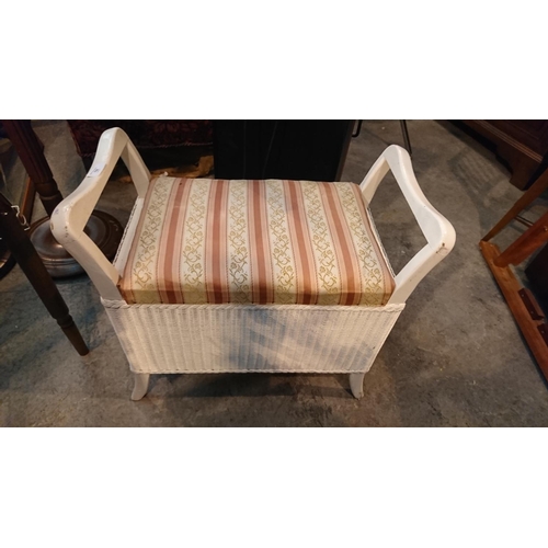 758 - white cushioned wicker stool with fake plants